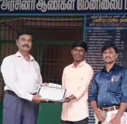 தமிழில் முதலிடம் பெற்ற மாணவனுக்கு பாராட்டு.