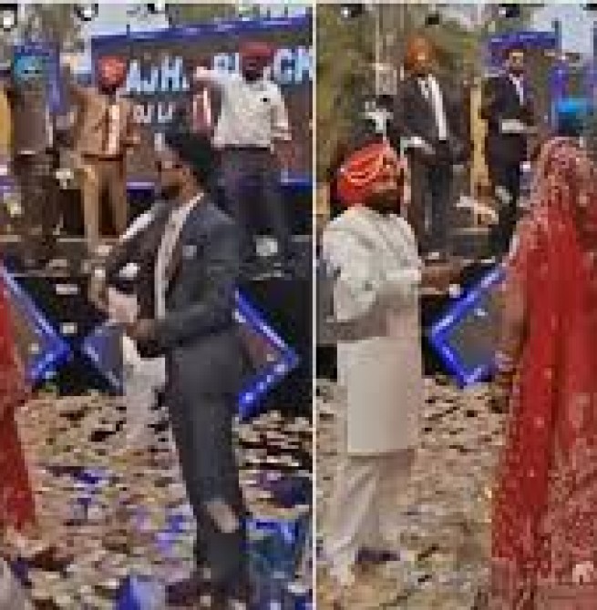 திருமண வரவேற்பில் மணமகளை ரூபாய் நோட்டுகளை தூவி வரவேற்ற மணமகன் குடும்பத்தினர்